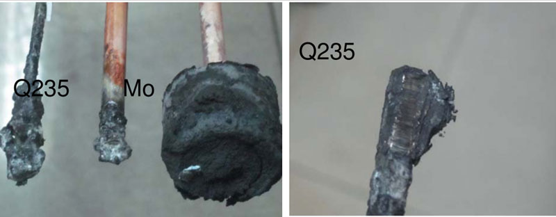 A two-panel image comparing the appearance of deposits on different metal rods, labeled Q235 and Mo, after an experiment. A two-panel image comparing the appearance of deposits on different metal rods, labeled Q235 and Mo, after an experiment.